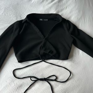 Black Zara v-neck long sleeve with a wrap around strings and a collar.
